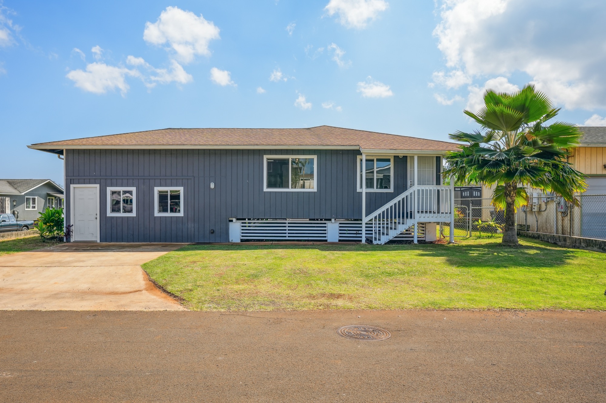 1974 Nana Pali Road Lihue, HI 96766 - Photo 1 of 28 a front view of house with yard and swimming pool