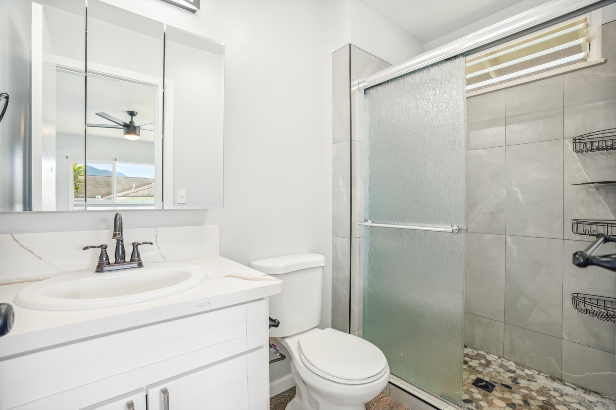 1974 Nana Pali Road Lihue, HI 96766 - Photo 19 of 28 a bathroom with a sink toilet and shower