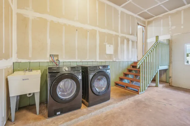 a utility room with dryer and washer