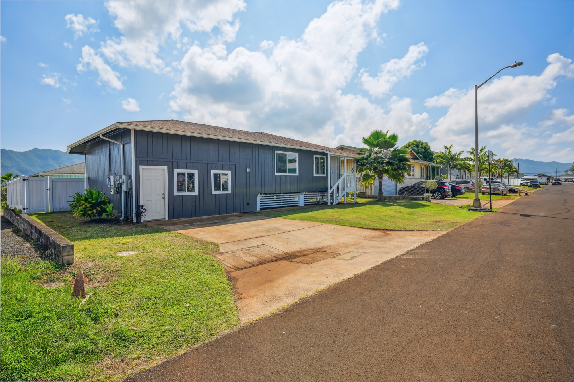 1974 Nana Pali Road Lihue, HI 96766 - Photo 6 of 28 a front view of a house with a yard