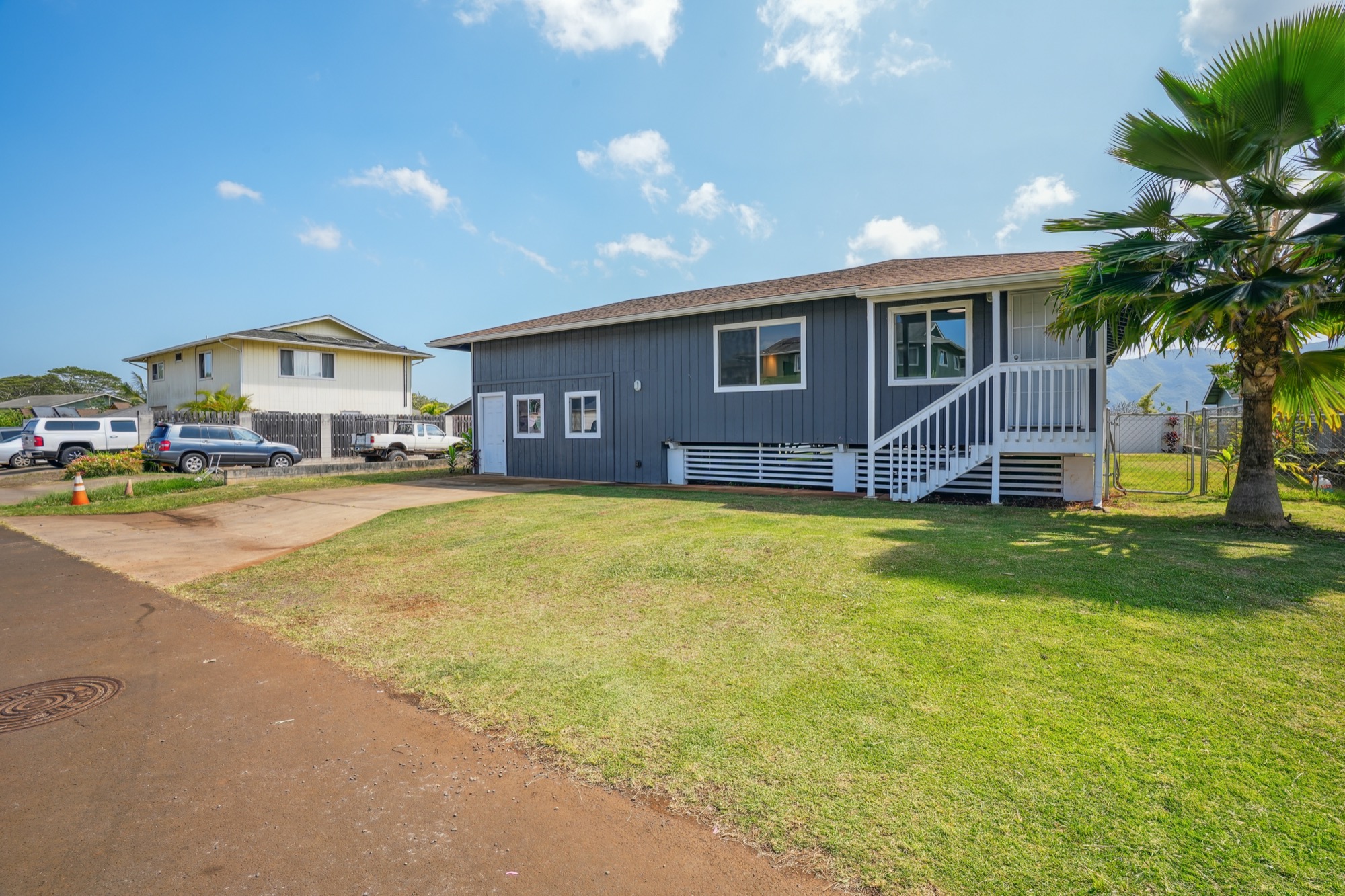 1974 Nana Pali Road Lihue, HI 96766 - Photo 7 of 28 a front view of a house with a big yard