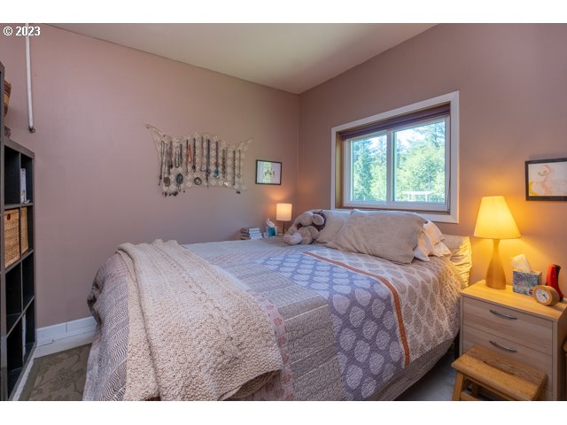 32175 Upper Nestucca River Road Beaver, OR 97108 - Photo 14 of 21 a bedroom with a bed and window