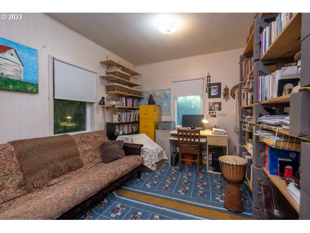 32175 Upper Nestucca River Road Beaver, OR 97108 - Photo 16 of 21 a living room with furniture and a fireplace