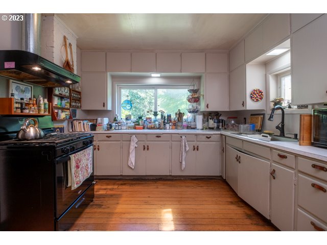 32175 Upper Nestucca River Road Beaver, OR 97108 - Photo 17 of 21 a kitchen with stainless steel appliances granite countertop a stove a sink and a microwave