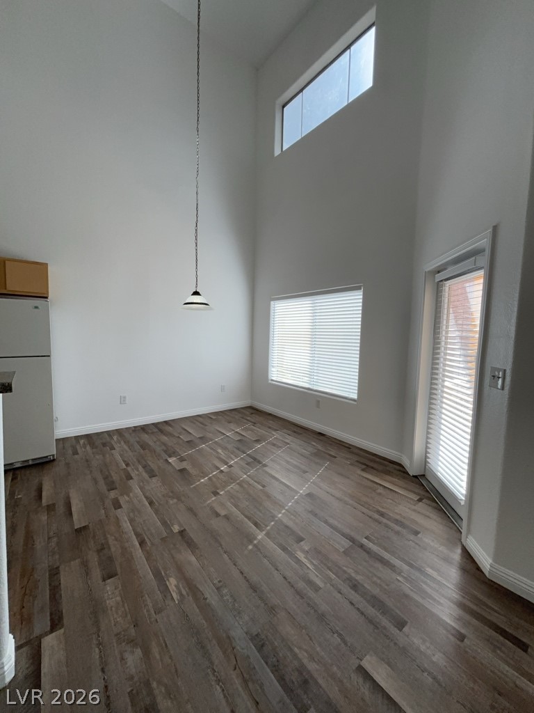 4915 East Russell Road, Unit 151 Las Vegas, NV 89120 - Photo 3 of 9 Vaulted ceilings and vinyl flooring maximize the sense of space in this dining area.