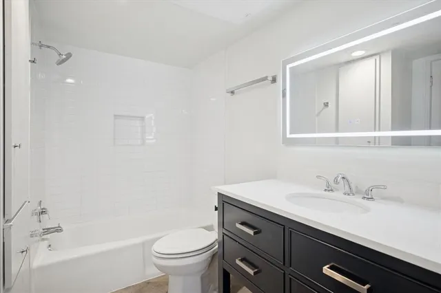 a bathroom with a sink a toilet and a bathtub