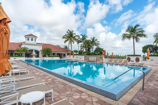 swimming pool view with a outdoor seating space
