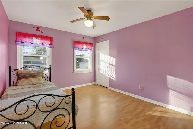 a view of entryway with a table and a chandelier fan