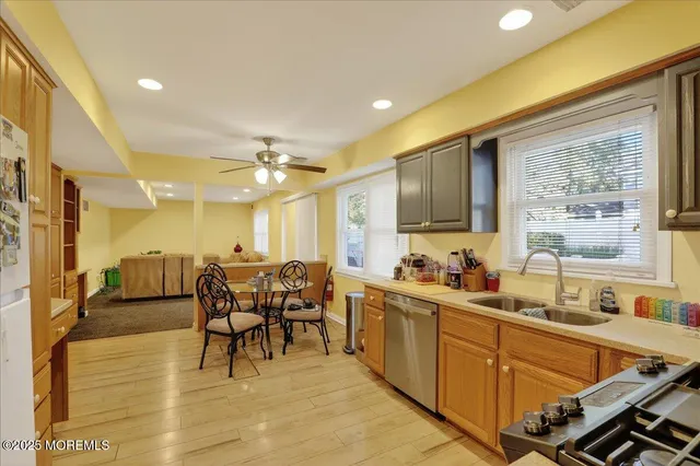 a large kitchen with lots of counter space and windows