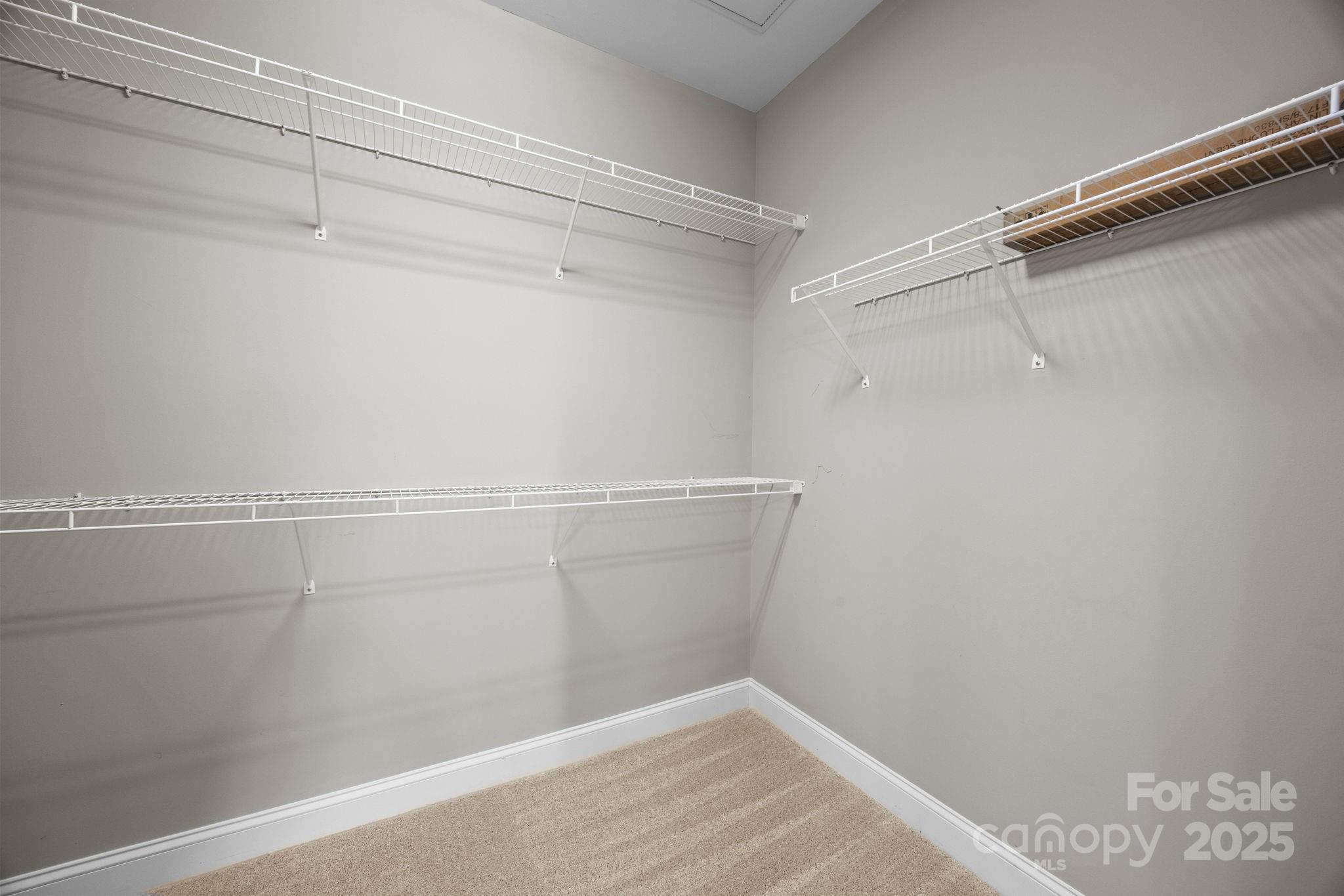 1000 East Woodlawn Road, Unit 413 Charlotte, NC 28209 - Photo 16 of 32 a view of a room with racks on the wall