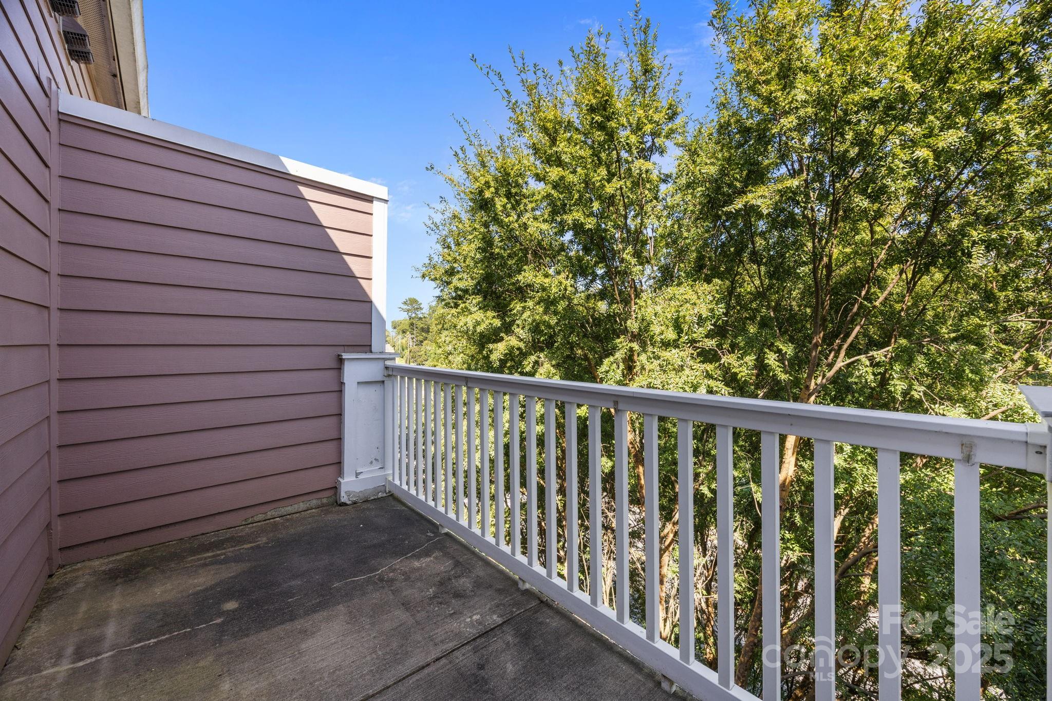 1000 East Woodlawn Road, Unit 413 Charlotte, NC 28209 - Photo 22 of 32 a view of a wooden fence