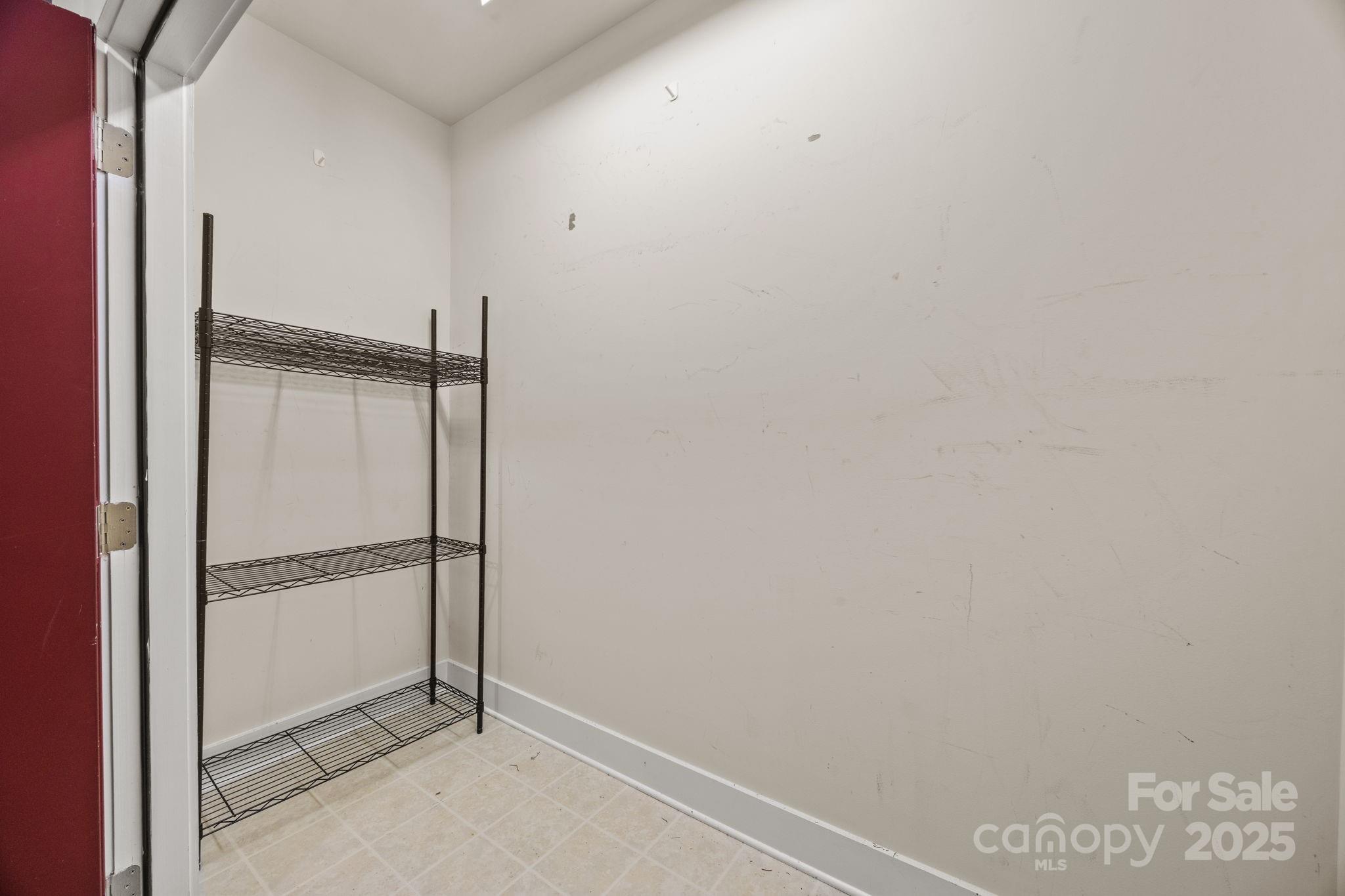 1000 East Woodlawn Road, Unit 413 Charlotte, NC 28209 - Photo 25 of 32 a view of an empty room