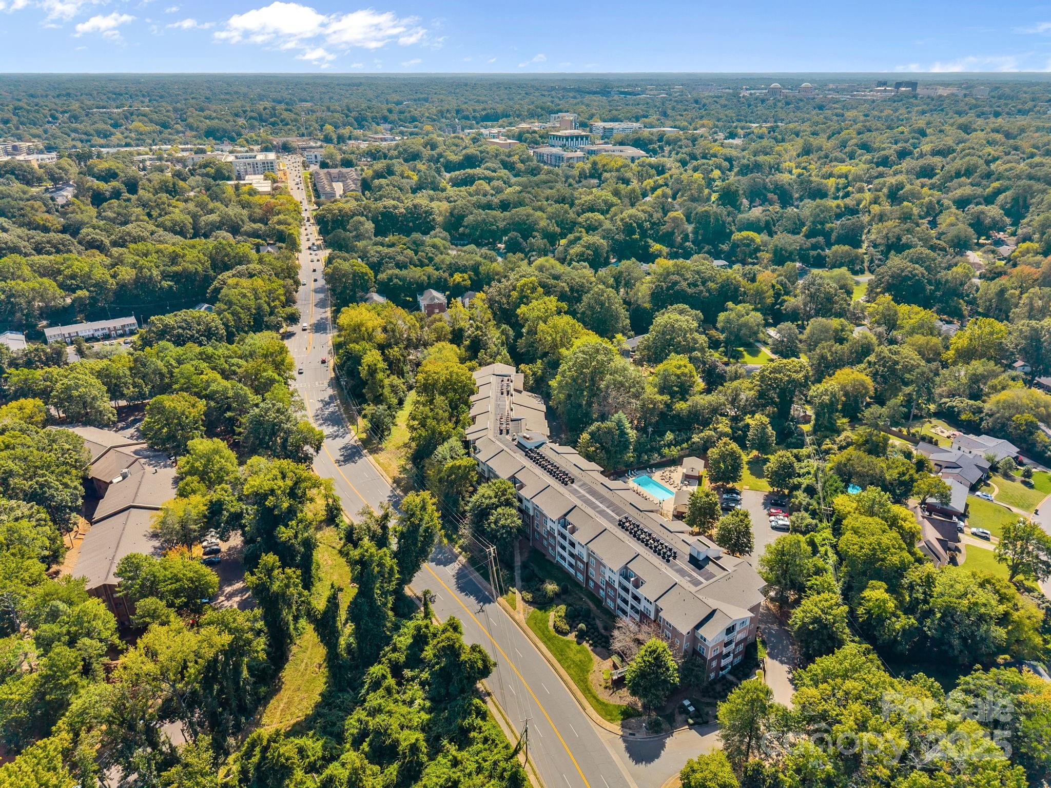 1000 East Woodlawn Road, Unit 413 Charlotte, NC 28209 - Photo 31 of 32 a view of a city with mountain