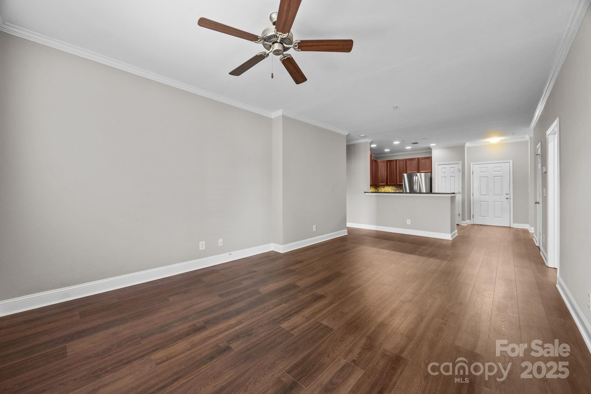 1000 East Woodlawn Road, Unit 413 Charlotte, NC 28209 - Photo 10 of 32 a view of empty room with wooden floor