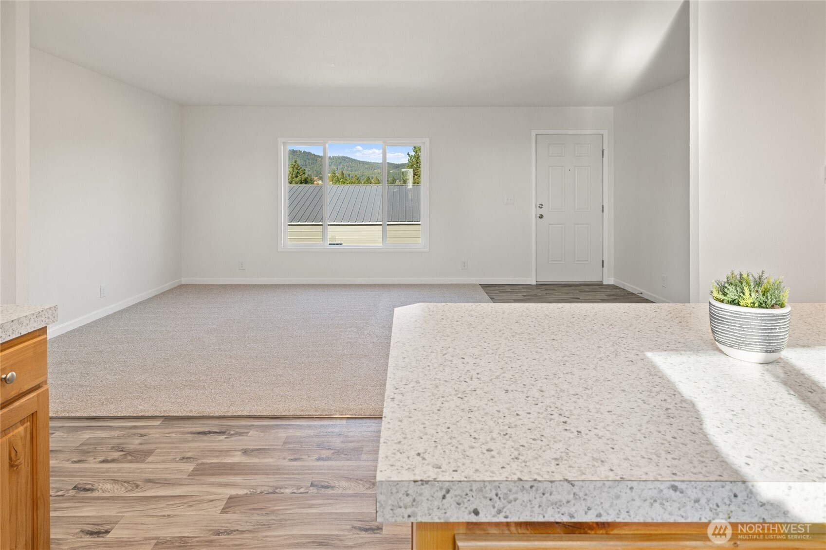 651 Highline Loop Cle Elum, WA 98922 - Photo 18 of 33 a view of a livingroom with wooden floor and a potted plant