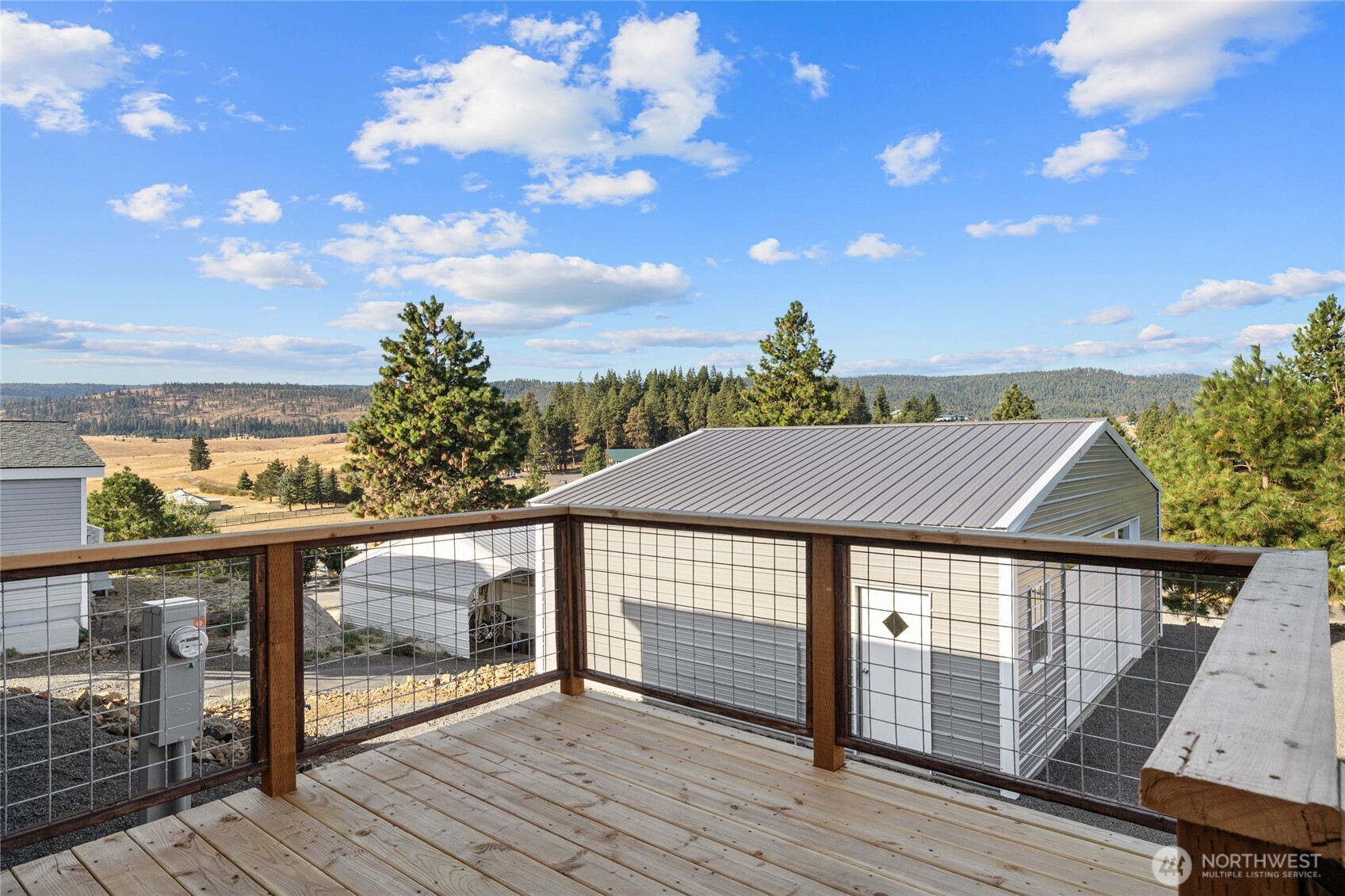 651 Highline Loop Cle Elum, WA 98922 - Photo 22 of 33 a view of a roof deck with wooden floor and fence