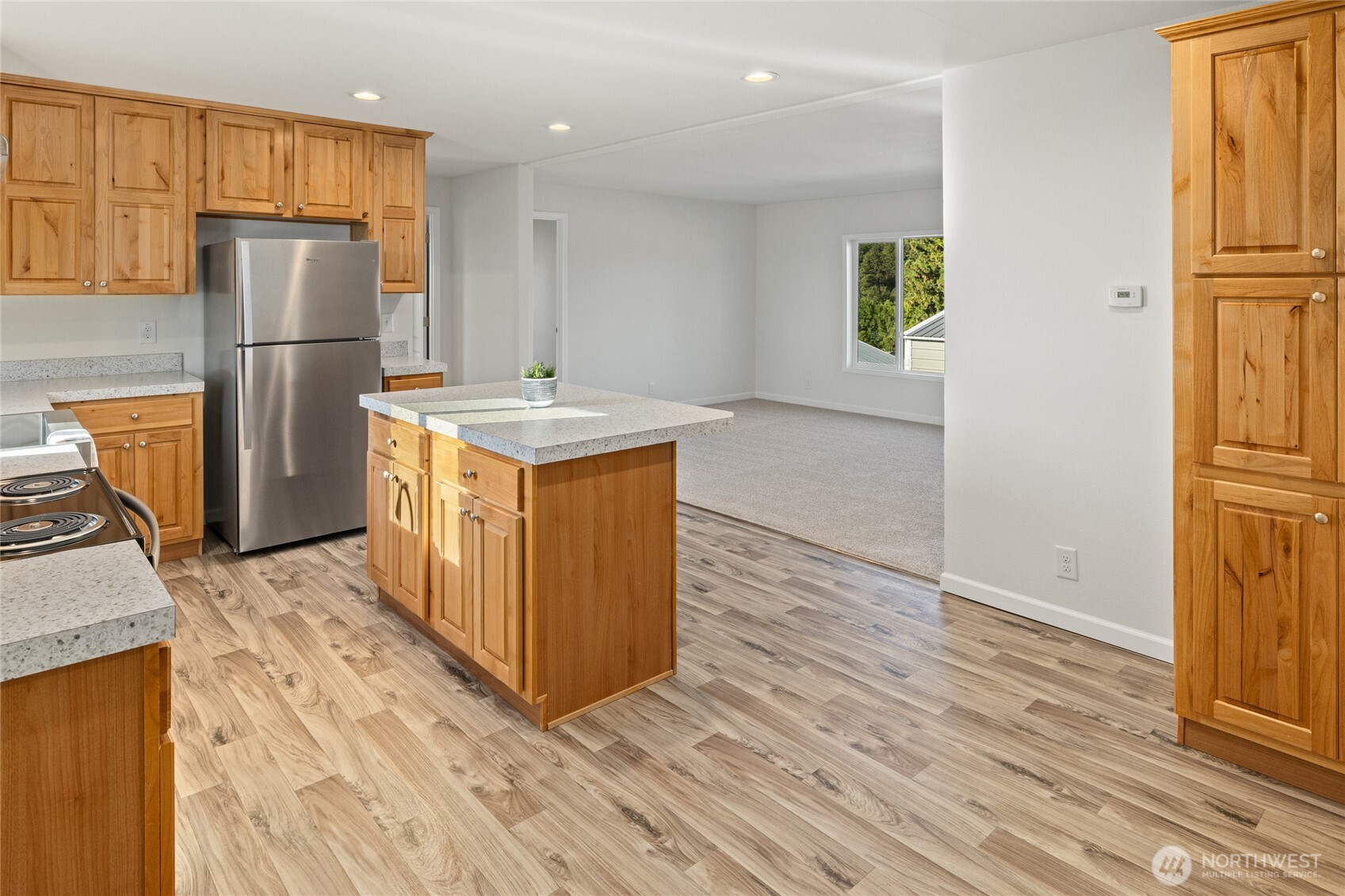 651 Highline Loop Cle Elum, WA 98922 - Photo 4 of 33 a kitchen with a refrigerator a stove top oven a refrigerator and a counter space