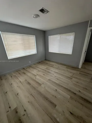 a view of an empty room and window