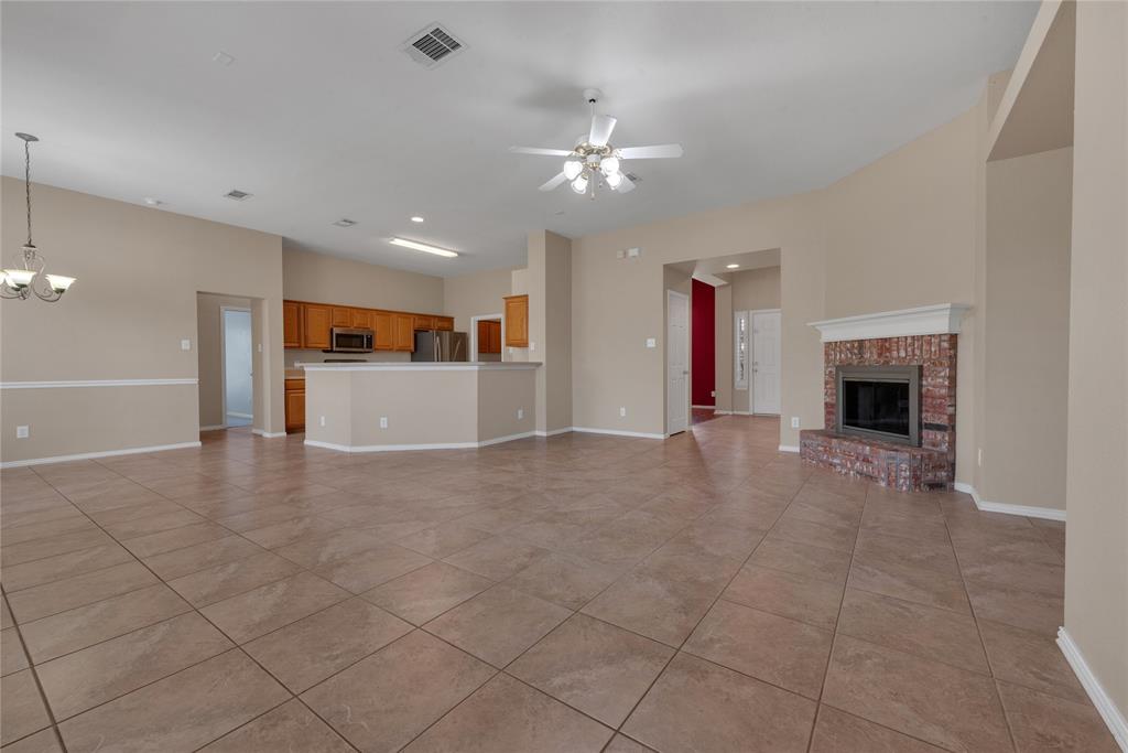 910 Derby Court Celina, TX 75009 - Photo 9 of 27 a view of a livingroom with furniture and a fireplace