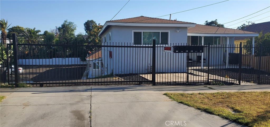 2806 Tenth Street Riverside, CA 92507 - Photo 1 of 1 a front view of a house with a fence
