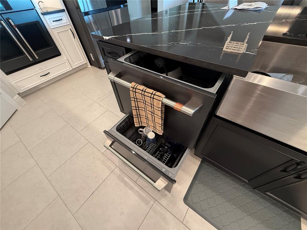 10958 Rustic Timber Loop San Antonio, FL 33576 - Photo 14 of 48 a stove top oven sitting inside of a kitchen