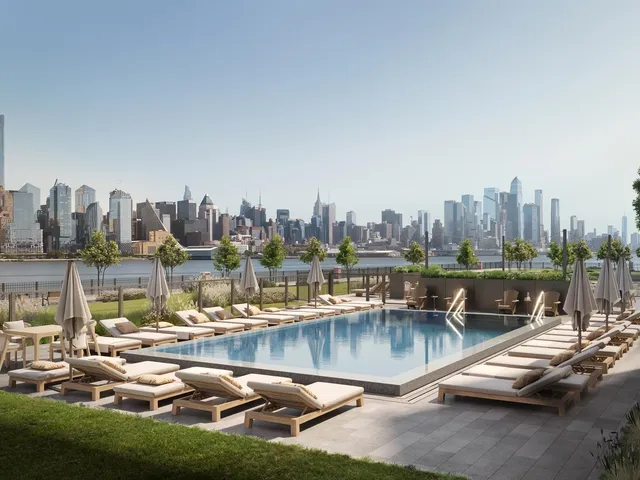 a view of swimming pool with outdoor seating and city view