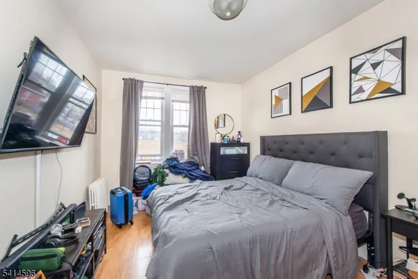 a bedroom with a bed and glass windows