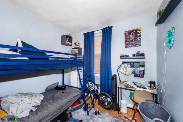 a room with furniture and wooden floor