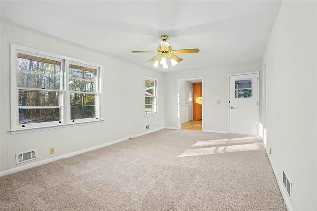 a view of an empty room with a window