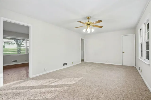 a view of an empty room with a window