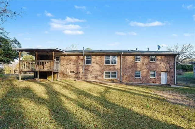 a swimming pool with trees in the background