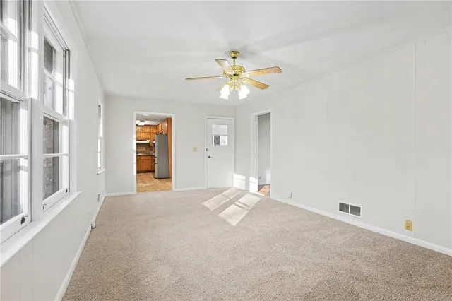 a view of an empty room with a window