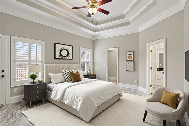 a bedroom with a bed and ceiling fan