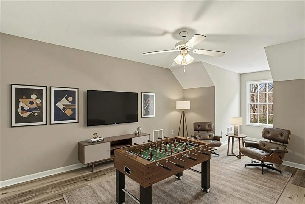 25 Inverleigh Row Covington, GA 30014 - Photo 21 of 28 a living room with furniture and a flat screen tv