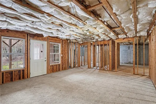 a balcony with wooden floor and fence
