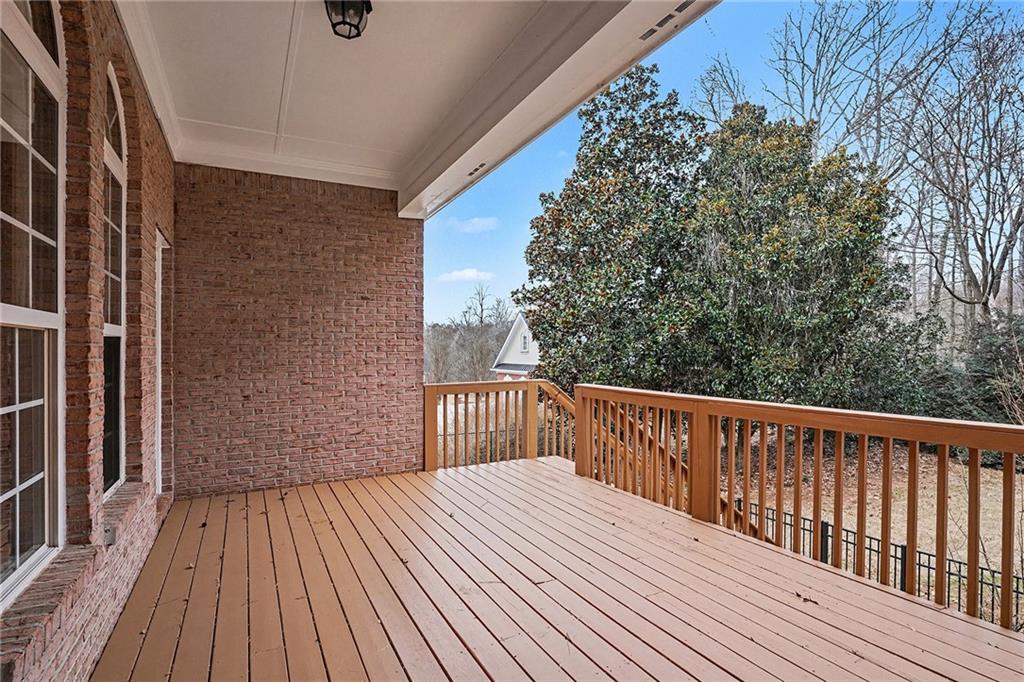 25 Inverleigh Row Covington, GA 30014 - Photo 27 of 28 a balcony with wooden floor and fence