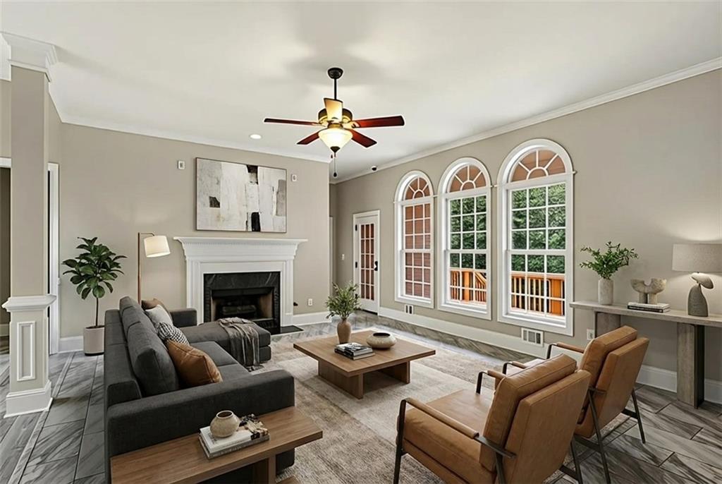 25 Inverleigh Row Covington, GA 30014 - Photo 3 of 28 a living room with furniture fireplace and a large window
