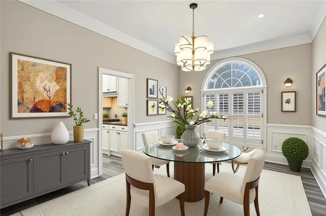 a dining room with wooden floor and breakfast area