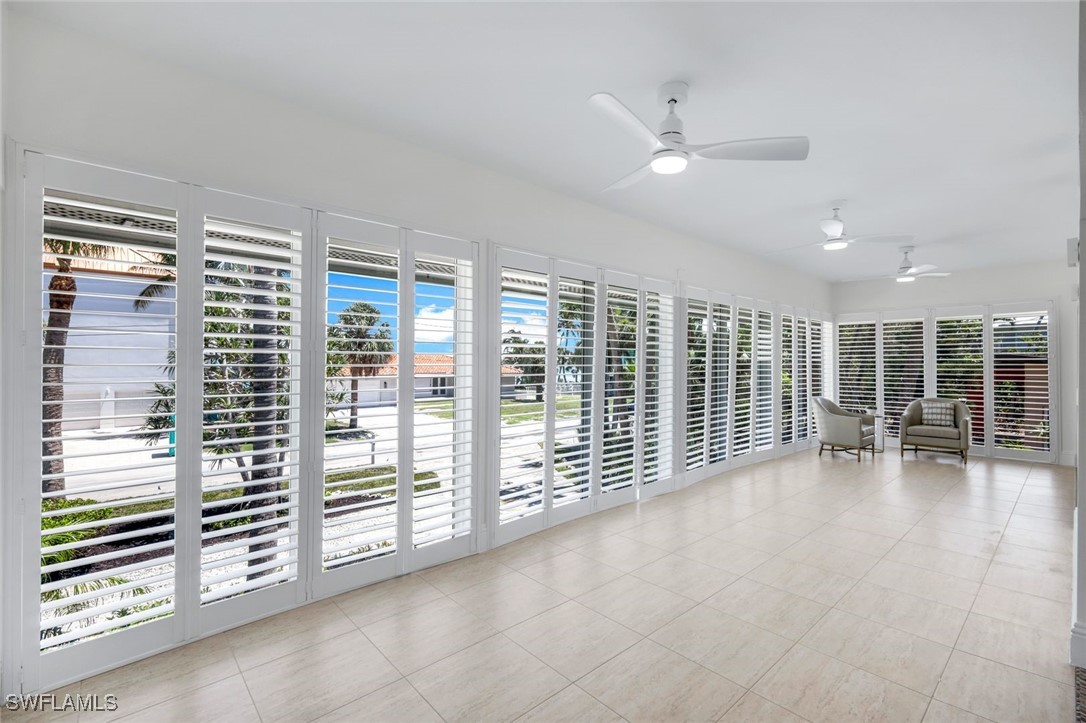 513 Lighthouse Way Sanibel, FL 33957 - Photo 16 of 44 a view of an empty room with furniture and a window
