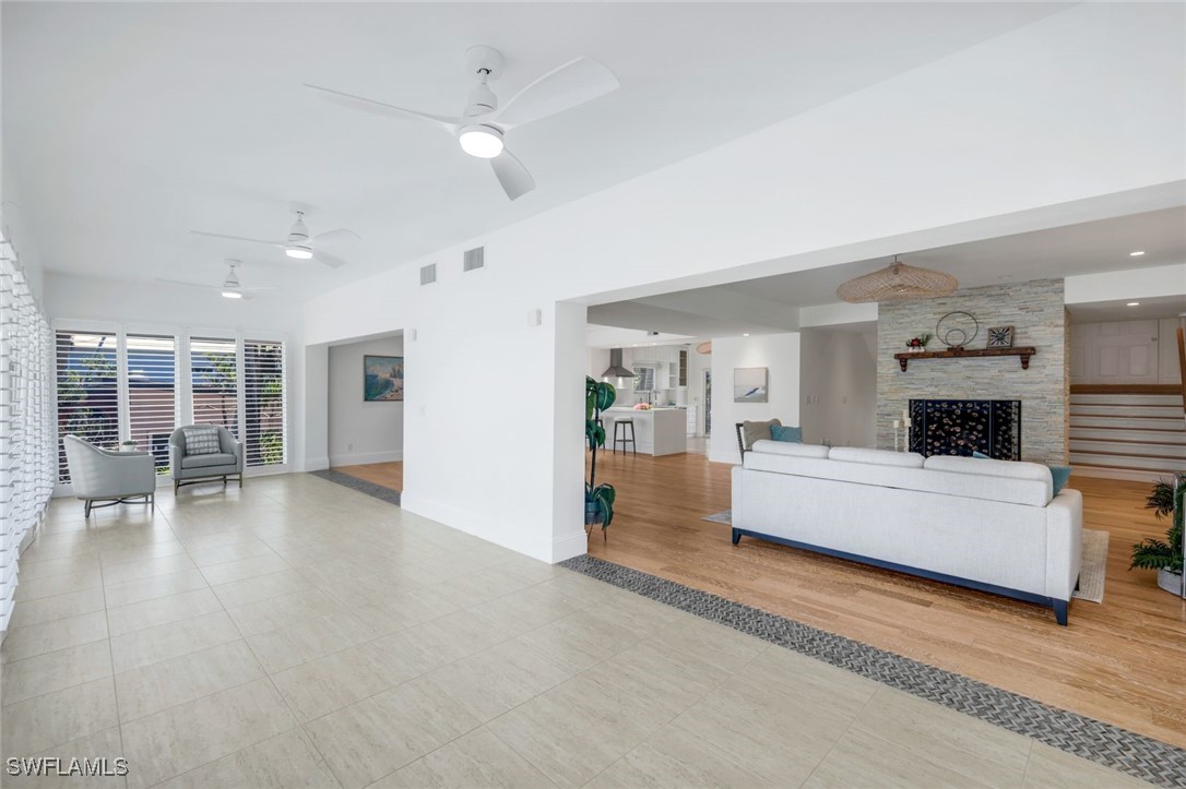 513 Lighthouse Way Sanibel, FL 33957 - Photo 17 of 44 a living room with furniture and a fireplace
