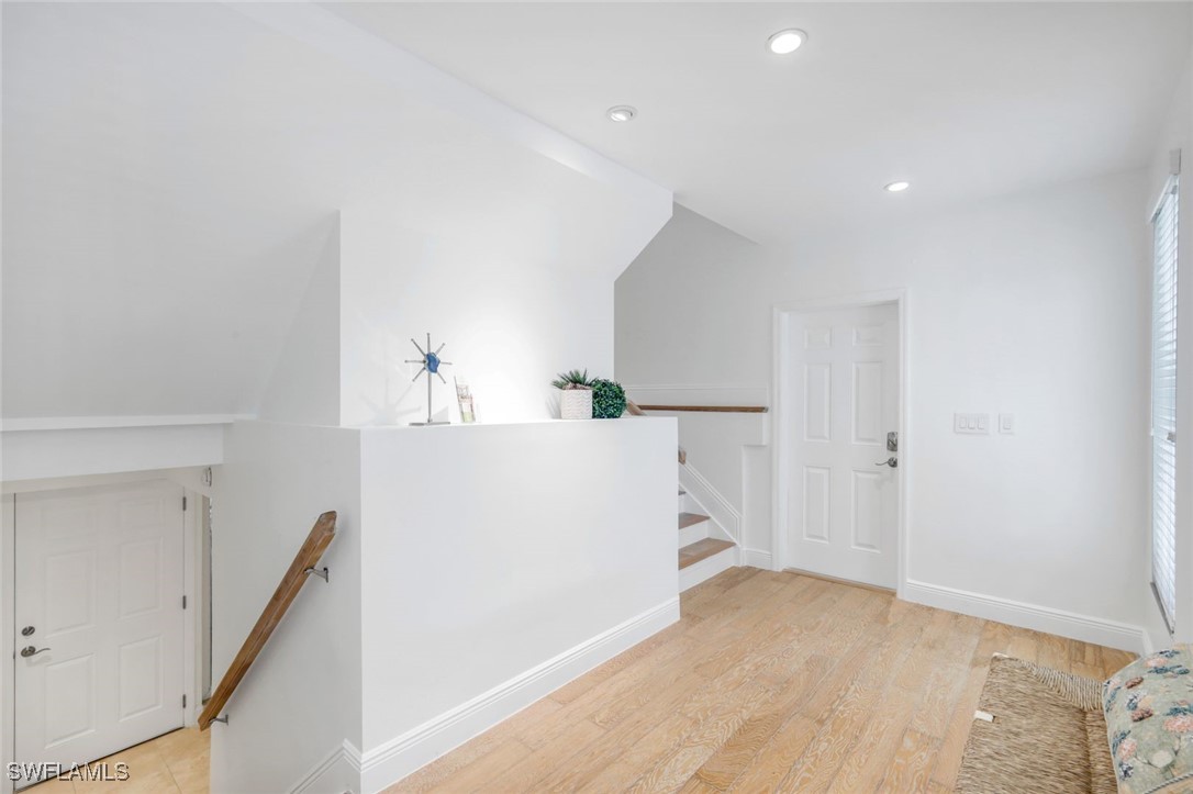 513 Lighthouse Way Sanibel, FL 33957 - Photo 20 of 44 a view of a kitchen with refrigerator and white cabinets