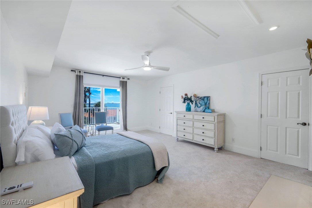 513 Lighthouse Way Sanibel, FL 33957 - Photo 22 of 44 a bedroom with a bed and a window