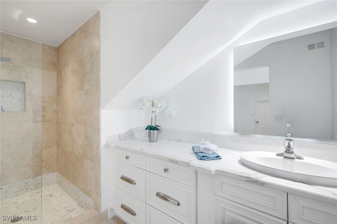 513 Lighthouse Way Sanibel, FL 33957 - Photo 28 of 44 a bathroom with a sink and a mirror