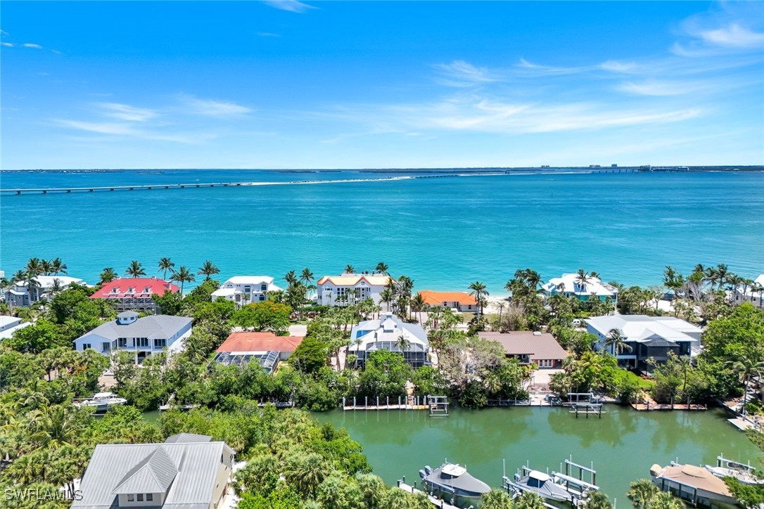 513 Lighthouse Way Sanibel, FL 33957 - Photo 3 of 44 a view of a lake with a house