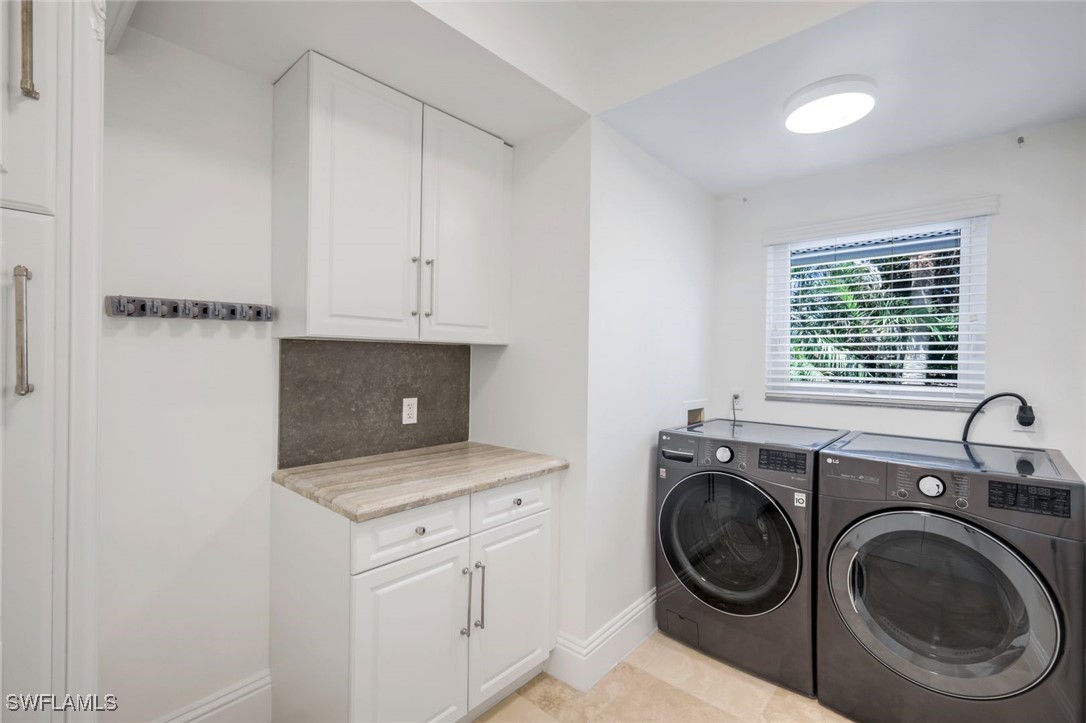 513 Lighthouse Way Sanibel, FL 33957 - Photo 35 of 44 a view of a storage and utility room with washer and dryer