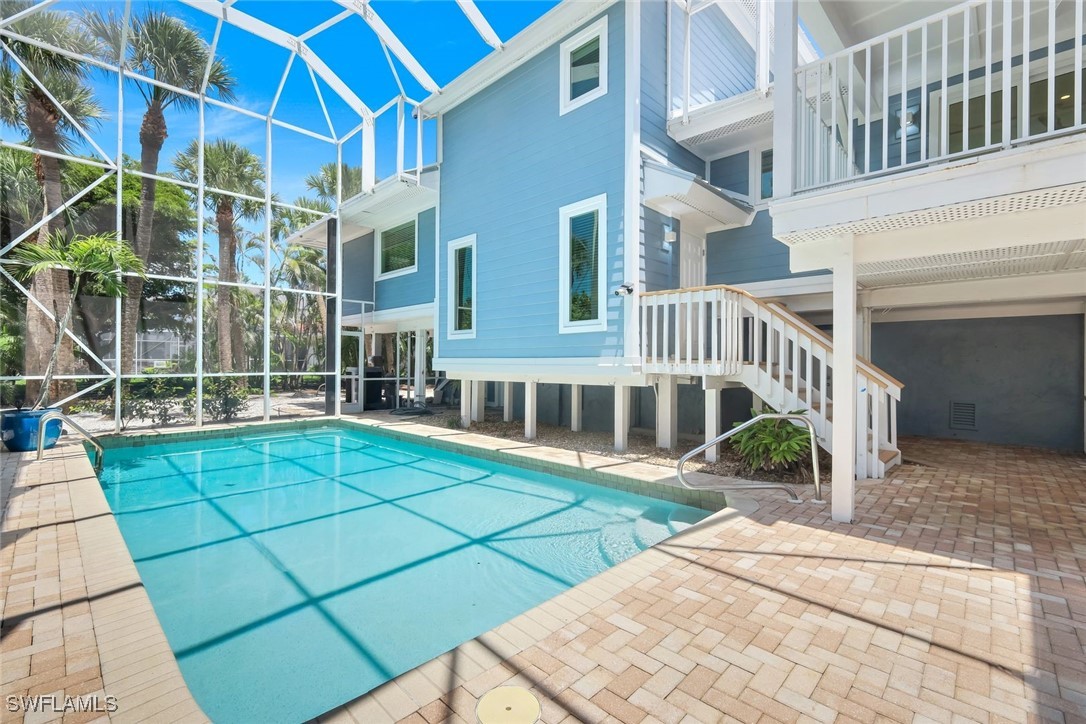 513 Lighthouse Way Sanibel, FL 33957 - Photo 39 of 44 a view of a house with a yard