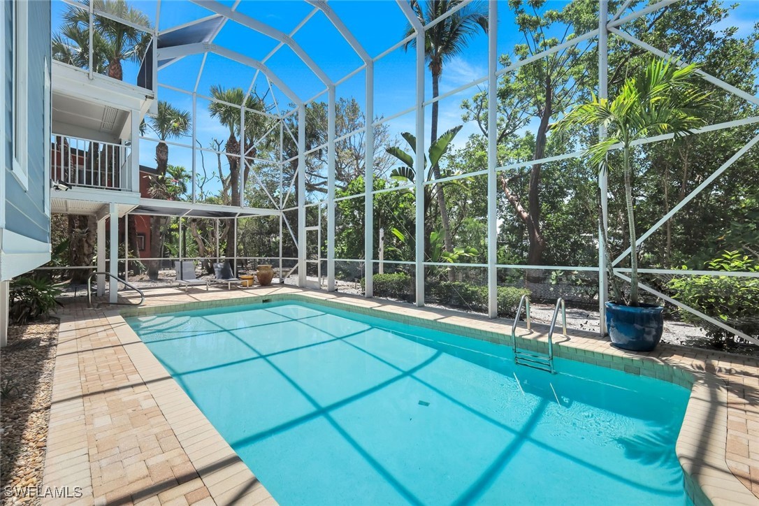 513 Lighthouse Way Sanibel, FL 33957 - Photo 40 of 44 a view of a house with a backyard