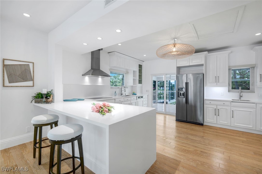 513 Lighthouse Way Sanibel, FL 33957 - Photo 10 of 44 a large kitchen with a counter space and stainless steel appliances