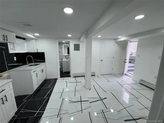 a kitchen with stainless steel appliances a refrigerator and a counter top space