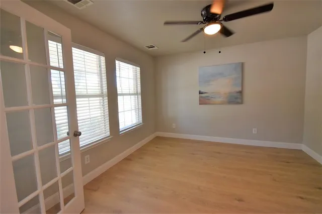 a view of an empty room with a window